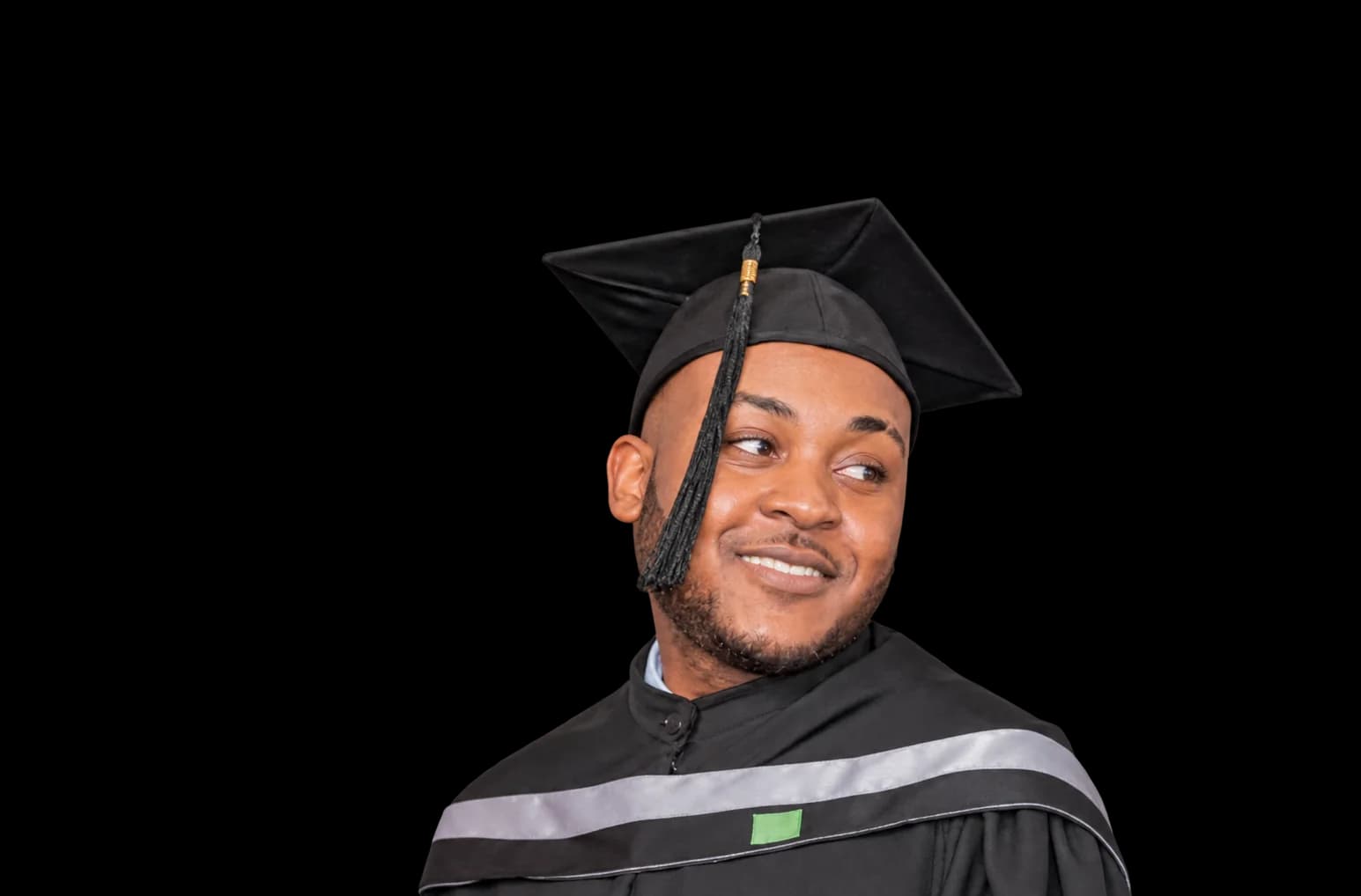 Head-and-shoulders portrait of Pedro wearing his graduation cap